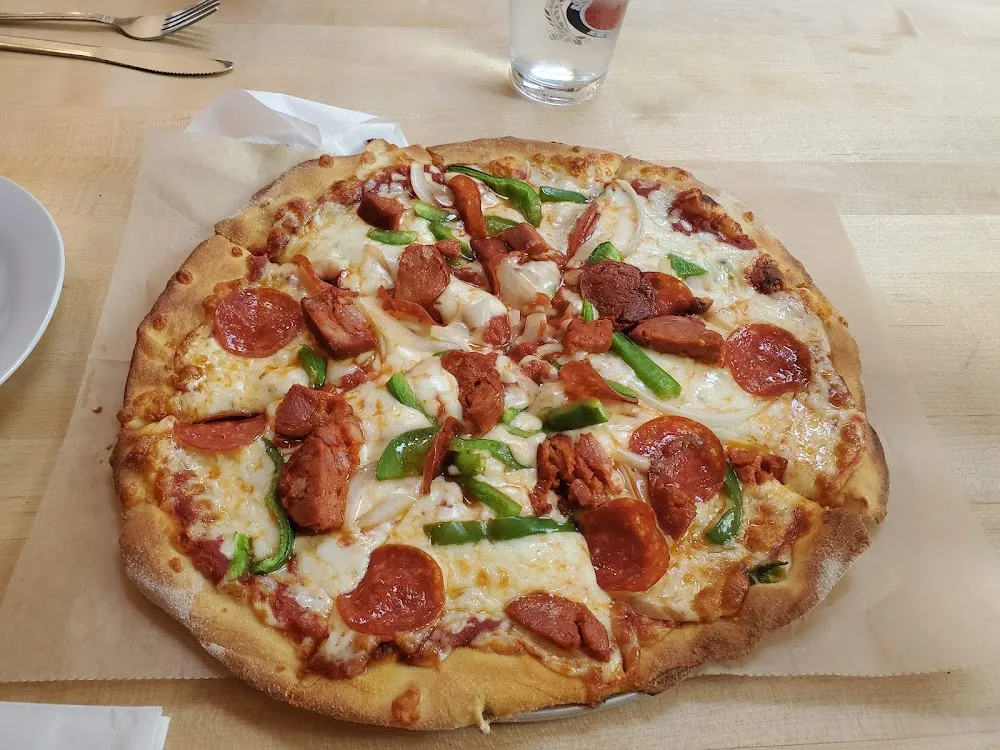 Pepperoni Sausage Onion and Pepper Pizza